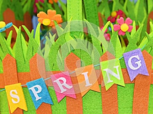 Springtime sign and colorful background of colored flowers