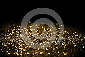 Sprinkle gold dust on a black background photo