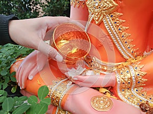 Sprinkle water onto a Buddha statue ,Songkran