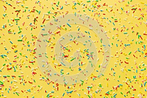 sprinkles over yellow background, decoration for festive Valentines day, birthday, holiday and party time