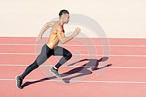 Sprinter leaving on the running track.