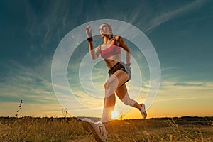 Sprinter run. Strong athletic woman running on black background wearing in the sportswear. Fitness and sport motivation