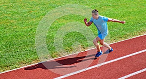 Sprinter training at stadium track. Runner captured in midair. Short distance running challenge. Boost speed. Athlete