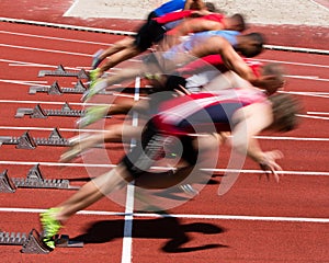 Sprinters start in blurred motion