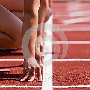 Sprinters start in track and field