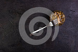 Sprots in a glass jar with a fork. . Copy space