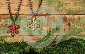 Spruce branch and  decoration on a wooden background.