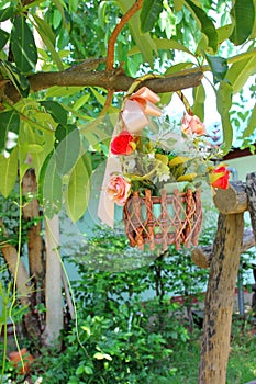 Spurious roses in flower basket