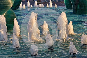 Spurts in fountain at sunset photo