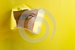 Spy eye watching through a hole isolated