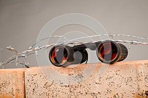 Spy glass atop of a wall