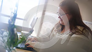 Spy like image of chubby girl in a bright cafe