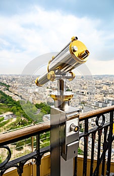 A spyglass for tourists, installed on a high point to view a European city