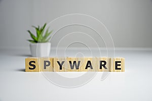 spyware word written on wood block. spyware text on wooden table for your desing, concept