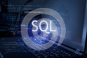 SQL inscription against laptop and code background. Learn sql programming language, computer courses, training photo
