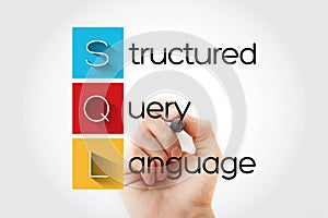 SQL - Structured Query Language acronym with marker, technology concept background