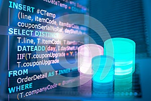 SQL (Structured Query Language) code on computer monitor with Database and server room background