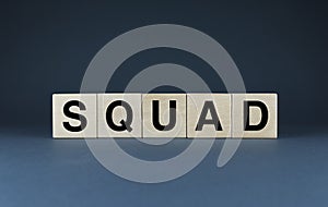 Squad. Cubes form the word Squad. The broad concept of the word Squad