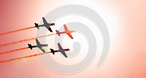 Squad of four airplanes flying together passing in front of the