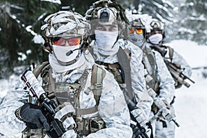 Squad of soldiers in winter forest