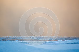 Squall snow clouds at dawn over Lake Huron