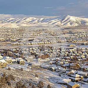 Square Aerial view of homes in a neighborhood amidst picturesque nature scenery