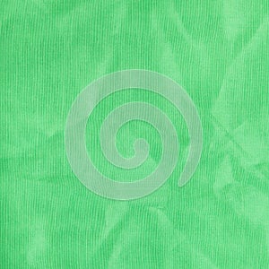 Square background from light green batiste fabric