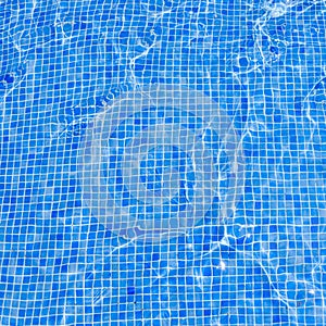 Square background swimming pool floor water covered blue tiles