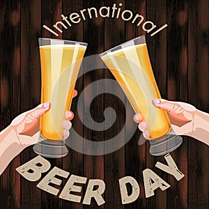 Square banner with two hands holding pilsner glasses with beer on wooden background. Light beer with foam. International