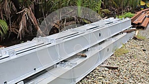 Square Bar Steel with a Silver Coated Paint Pile using in Construction Material for new Building, Construction Site land area