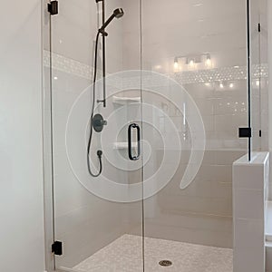 Square Bathroom shower stall with half glass enclosure adjacent to built in bathtub
