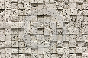 Square beige pebbles for decoration. Stone background