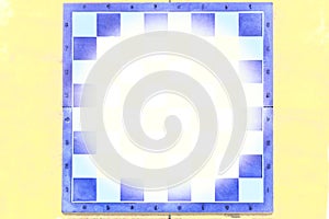 Blue chess board on yellow background with place for text