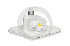 Square bottle soap and flower on white towel white background