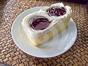 Square cake on white dish