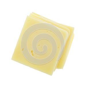 Square cheddar cheese slices on white background