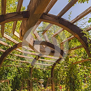 Square Close up of the wooden arbor at a wedding venue under blue sky on a sunny day