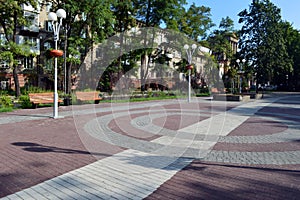 Square with colored tiles and benches