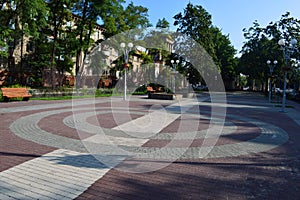 Square with colored tiles and benches