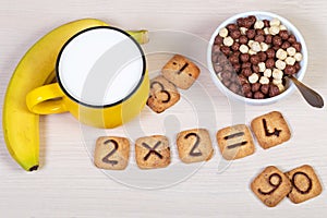 Square cookies with chocolate numerals on them isolated on white