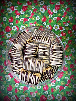 Square cookies with chocolate topping photo