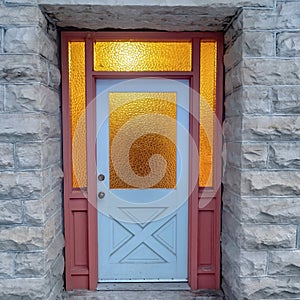 Square crop Frosted glass panes on the front door sidelights and transom window of home photo