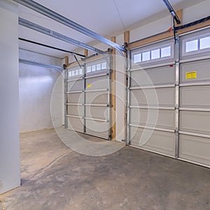 Square crop Inside an empty closed garage interior door