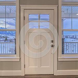 Square crop White front door flanked by windows interior