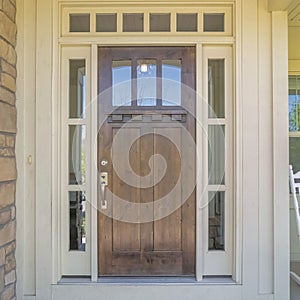 Square Dark wooden front door with transom window and side panels