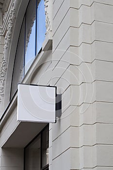 Square empty signboard on a building with classical architecture