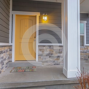 Square Entryway of a home with stairs going up to the front porch and door