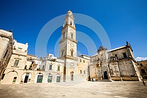 Square of the famous basilica Church of the Holy Cross. Historic city of Lecce, Italy. Blue sky cloudless photo