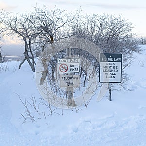 Square Foot path and signages at the snow covered slope of Wasatch Mountains in winter