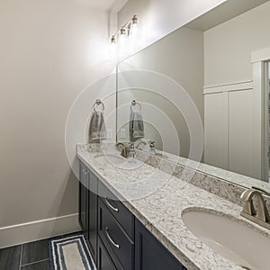 Square frame Bathroom interior with double vanity sink and separate toilet